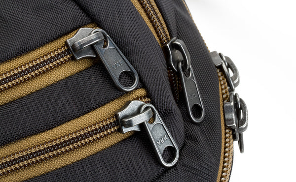 A shot of the zippers on the face of the Guide's Edition Synapse 25.